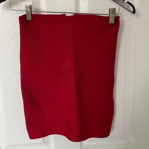 Bebe gently worn bandage mini skirt in red